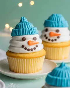 Deliciously Cute Vanilla Snowman Cupcakes with Vanilla Icing