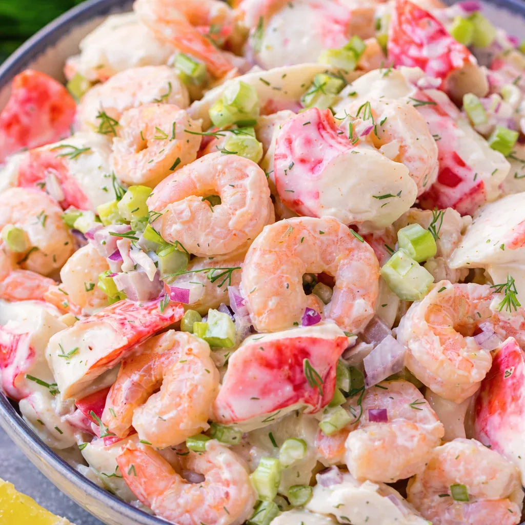 A delicious EASY SEAFOOD SALAD with crab and shrimp in a creamy dill dressing.