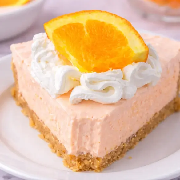 Delicious Jell-O Creamsicle Pie with creamy orange filling and graham cracker crust.