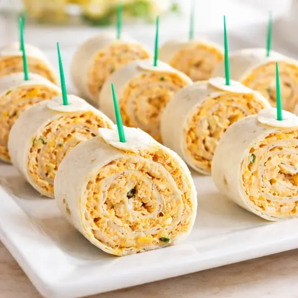 Delicious Buffalo Chicken Roll-Ups filled with chicken and cream cheese in tortillas