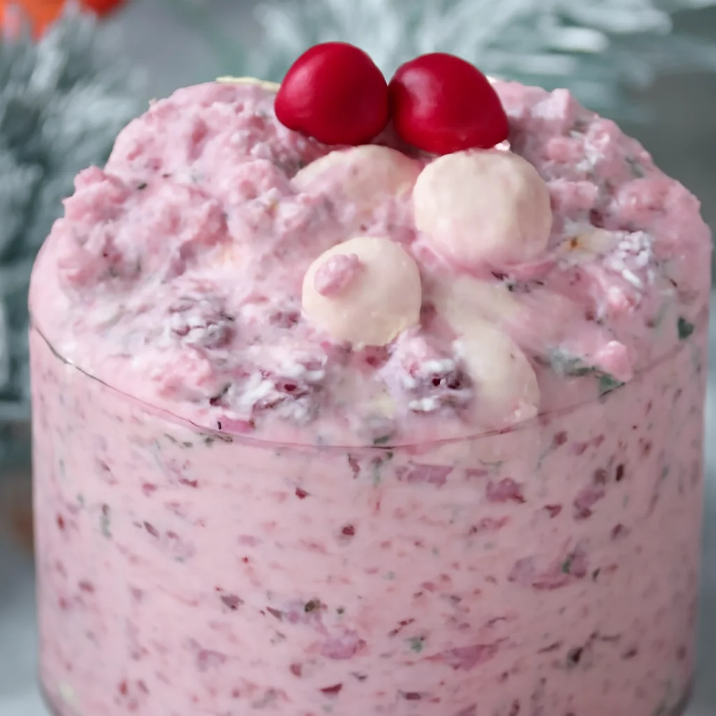 Creamy Cranberry Fluff Salad with pineapple, marshmallows, and cranberries served in a bowl.