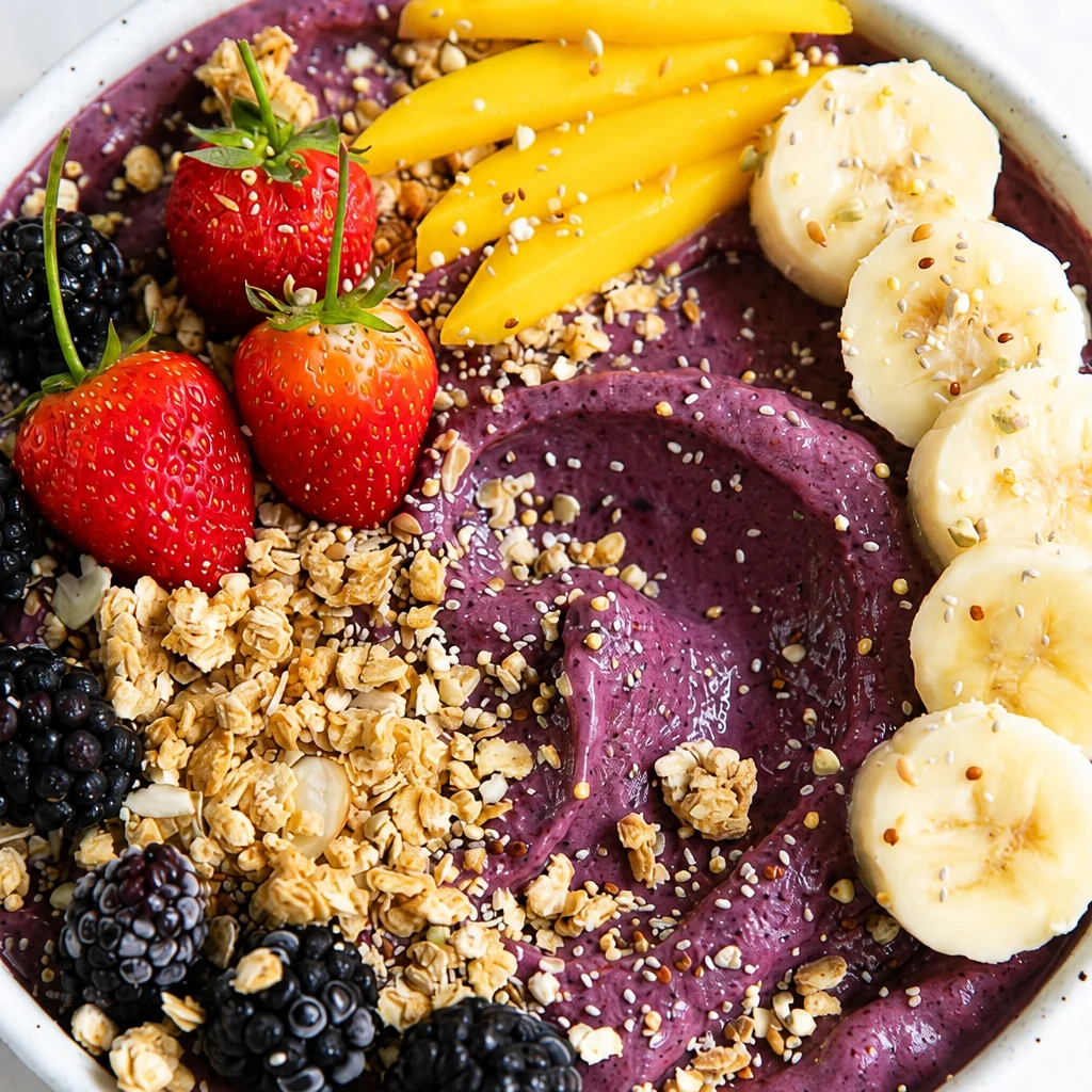 Homemade Easy Acai Bowl topped with fruits and granola for a healthy breakfast