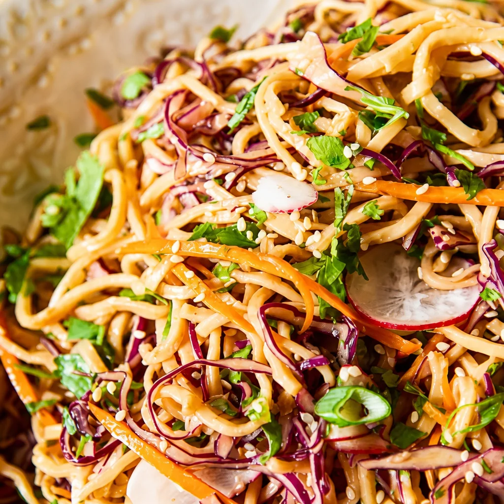 Delicious Easy Peanut Noodle Bowl with fresh vegetables and peanut dressing.