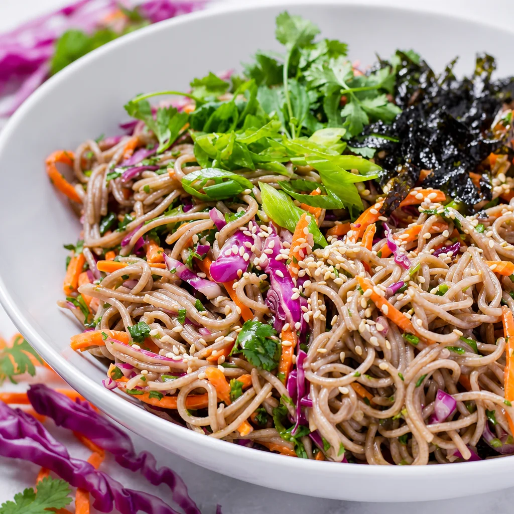 Easy Soba Noodle Salad with Cold Sesame Dressing featuring colorful vegetables and buckwheat noodles.
