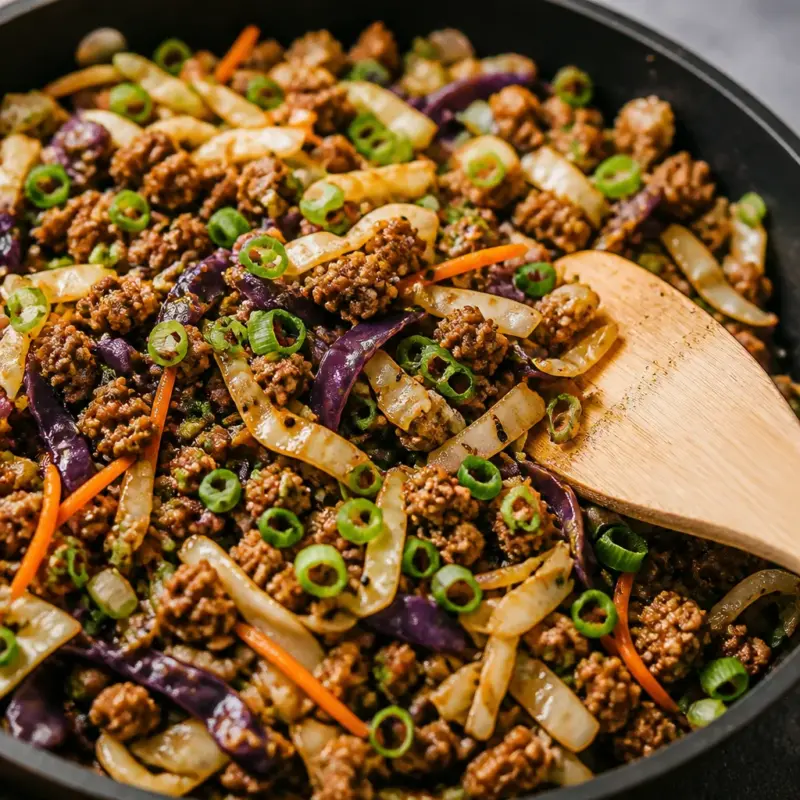 Easy Crack Slaw with ground beef and cabbage stir fry in a bowl