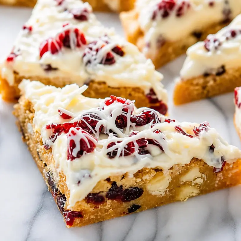 Delicious easy Cranberry Bliss Bars — Starbucks Copycat topped with cream cheese frosting.
