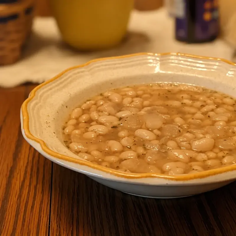 Bowl of Easy Navy Bean Soup with Ham Hock, a comforting one-pot meal.