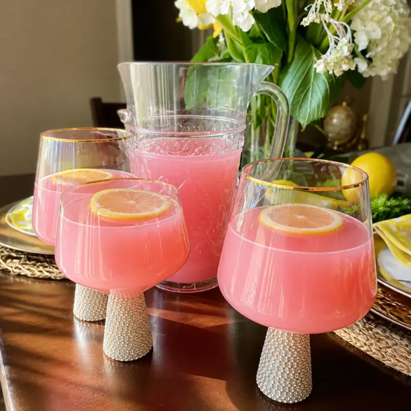 Refreshing Easy Pink Lemonade Punch in a glass, perfect for summer parties.