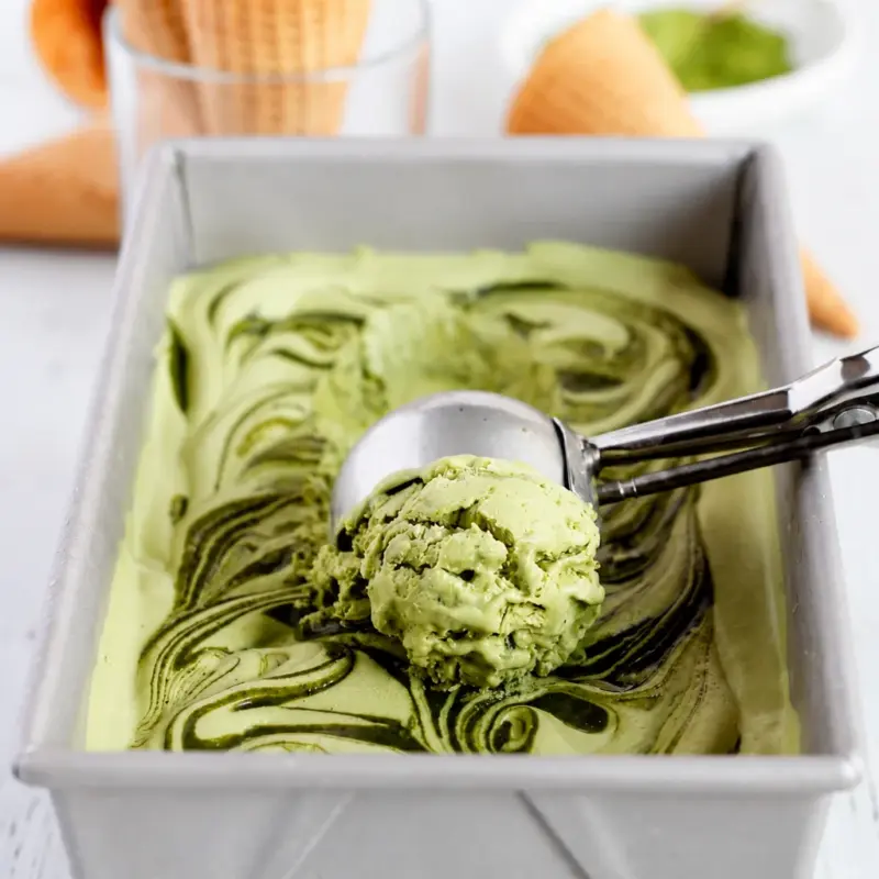 No churn strawberry matcha ice cream served in a bowl, rich color and smooth texture.