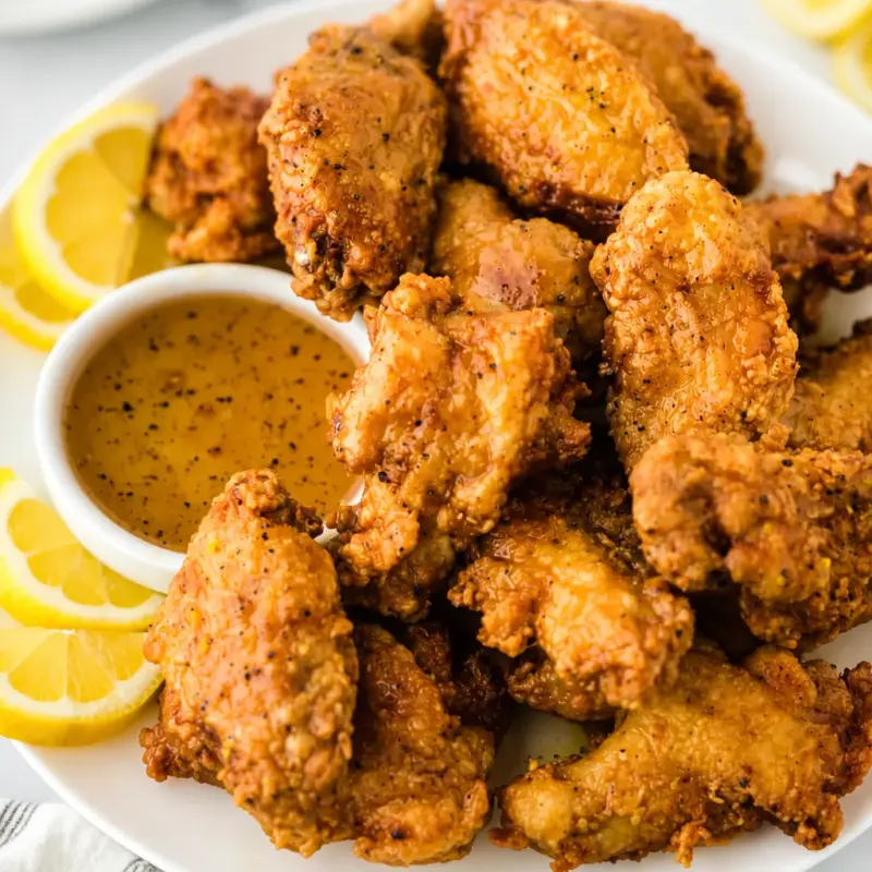 Delicious Easy Wingstop Lemon Pepper Wings - Copycat recipe for crispy chicken wings.